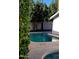 Refreshing pool with surrounding mature trees and a privacy wall at 2068 E Cairo Dr, Tempe, AZ 85282
