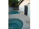 This backyard features a pool and a hot tub at 2068 E Cairo Dr, Tempe, AZ 85282