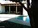 A freeform pool is surrounded by brick pavers, offering an inviting outdoor living space at 2068 E Cairo Dr, Tempe, AZ 85282