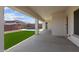 Covered patio with artificial turf and a view of the pool at 21541 W Mariposa St, Buckeye, AZ 85396