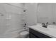 Bathroom featuring white vanity, commode, and shower/bath combination at 21541 W Mariposa St, Buckeye, AZ 85396