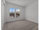 Bedroom with two windows featuring mountain views and neutral carpet at 21541 W Mariposa St, Buckeye, AZ 85396