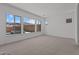 Bright bedroom with large windows offering views of the pool and backyard at 21541 W Mariposa St, Buckeye, AZ 85396