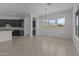 Inviting dining area with scenic views and a modern chandelier at 21541 W Mariposa St, Buckeye, AZ 85396