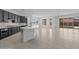 Gorgeous kitchen with a large island, dark cabinets, and stainless steel appliances at 21541 W Mariposa St, Buckeye, AZ 85396