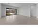 Bright living room with tile flooring, large sliding glass doors, and backyard views at 21541 W Mariposa St, Buckeye, AZ 85396
