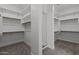 Large walk-in closet with ample shelving and hanging space at 21541 W Mariposa St, Buckeye, AZ 85396