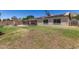 Green backyard with a brick fireplace, barbecue grill, and shed at 2423 E Dahlia Dr, Phoenix, AZ 85032