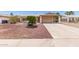 Charming single-story home featuring desert landscaping and covered carport at 2423 E Dahlia Dr, Phoenix, AZ 85032