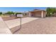 Single story house with covered carport and desert landscaping at 2423 E Dahlia Dr, Phoenix, AZ 85032