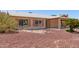 Well-maintained single-story home featuring desert landscaping and covered carport at 2423 E Dahlia Dr, Phoenix, AZ 85032