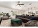 Spacious living room with large windows, adjoined to open kitchen at 2423 E Dahlia Dr, Phoenix, AZ 85032
