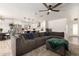Open concept living area featuring a spacious sectional sofa and modern kitchen at 2423 E Dahlia Dr, Phoenix, AZ 85032
