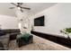 Comfortable living room with plush sofa and modern entertainment center at 2423 E Dahlia Dr, Phoenix, AZ 85032