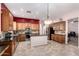 Well-equipped kitchen with stainless steel appliances, granite counters, and dark backsplash at 25633 N 71St Dr, Peoria, AZ 85383