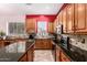 Well-designed kitchen with granite countertops, stainless steel appliances, and center island at 25633 N 71St Dr, Peoria, AZ 85383