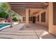 Spacious covered patio with pergola, ceiling fan, and view of backyard at 25633 N 71St Dr, Peoria, AZ 85383