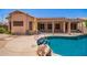 Backyard pool with lush landscaping and covered patio for relaxing or entertaining at 25633 N 71St Dr, Peoria, AZ 85383