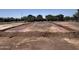 Active construction site of future house with prepared foundation and utility lines installed at 26209 N 19Th Ln, Phoenix, AZ 85085