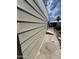 Exterior wall with siding and a glimpse of the side yard at 3104 E Broadway Rd # 348, Mesa, AZ 85203