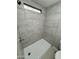Shower showcasing stylish grey and white tile work at 3104 E Broadway Rd # 348, Mesa, AZ 85203