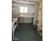 Storage room with workbench, shelving, and a window at 3104 E Broadway Rd # 348, Mesa, AZ 85203