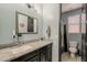 Bright bathroom with a single sink vanity and a shower, creating a functional space at 3173 N Clanton St, Buckeye, AZ 85396