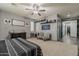 Large primary bedroom with neutral carpet and stylish decor, leading to a hallway at 3173 N Clanton St, Buckeye, AZ 85396