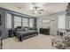 Spacious primary bedroom featuring a ceiling fan, ensuite bath and a large window at 3173 N Clanton St, Buckeye, AZ 85396