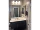 Clean and tidy bathroom with a vanity, mirror, and towel rack at 3211 W Pollack St, Phoenix, AZ 85041