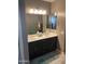 Bathroom featuring double sink vanity, tile floor and a walk-in shower at 3211 W Pollack St, Phoenix, AZ 85041