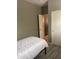 A basic bedroom features a twin bed, grey walls, and wood-look flooring at 3211 W Pollack St, Phoenix, AZ 85041