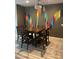 Dining room features wood table set, colorful wall art, and tile floors at 3211 W Pollack St, Phoenix, AZ 85041