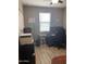 Well-lit home office with a window, desk, printer, and stylish wall decor at 3211 W Pollack St, Phoenix, AZ 85041