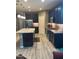 Spacious kitchen boasting a center island, stainless steel appliances, and tiled flooring at 3211 W Pollack St, Phoenix, AZ 85041