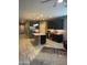 Open-concept kitchen featuring dark cabinets, a center island, and modern lighting at 3211 W Pollack St, Phoenix, AZ 85041