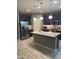 Modern kitchen with stainless steel appliances, an island, and stylish countertops at 3211 W Pollack St, Phoenix, AZ 85041