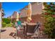 Relax in the cozy backyard patio with brick pavers, table, chairs and sun umbrella at 4043 E Carla Vista Dr, Gilbert, AZ 85295
