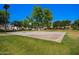 Community basketball court surrounded by shady trees and grassy area at 4043 E Carla Vista Dr, Gilbert, AZ 85295