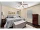 Bright primary bedroom features a ceiling fan, natural light, and stylish decor at 4043 E Carla Vista Dr, Gilbert, AZ 85295