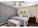 This primary bedroom has a ceiling fan and plenty of space at 4043 E Carla Vista Dr, Gilbert, AZ 85295