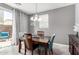Bright dining area with stylish table set and sliding door leading to outdoor patio space at 4043 E Carla Vista Dr, Gilbert, AZ 85295