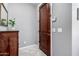 Entryway featuring tile floors, gray walls, a wood entry door, and a decorative console table at 4043 E Carla Vista Dr, Gilbert, AZ 85295
