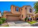Charming two-story home with a well-maintained lawn, mature trees, and desert landscaping at 4043 E Carla Vista Dr, Gilbert, AZ 85295