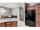 Open-concept kitchen features granite countertops and stainless-steel refrigerator at 4043 E Carla Vista Dr, Gilbert, AZ 85295