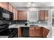 This kitchen features granite countertops, mosaic tile backsplash, and stainless steel appliances at 4043 E Carla Vista Dr, Gilbert, AZ 85295