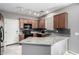 Well-lit kitchen with granite countertops, modern appliances, and ample cabinet storage at 4043 E Carla Vista Dr, Gilbert, AZ 85295