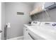 This laundry room features modern appliances, ample shelving, and stylish design at 4043 E Carla Vista Dr, Gilbert, AZ 85295