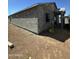 The side of an unfinished single-Gathering home with new window installation and a stucco exterior at 415 S Robert S Rd, Tempe, AZ 85281