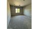 An empty new construction interior room with drywall and natural light from the window at 415 S Robert S Rd, Tempe, AZ 85281